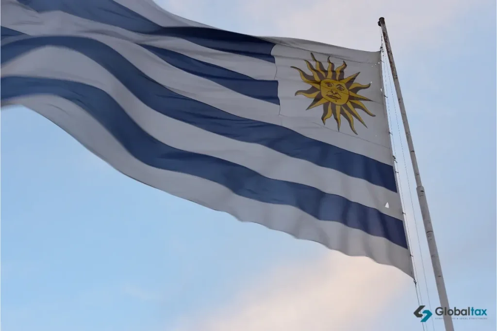 Uruguayan flag flying at sunset