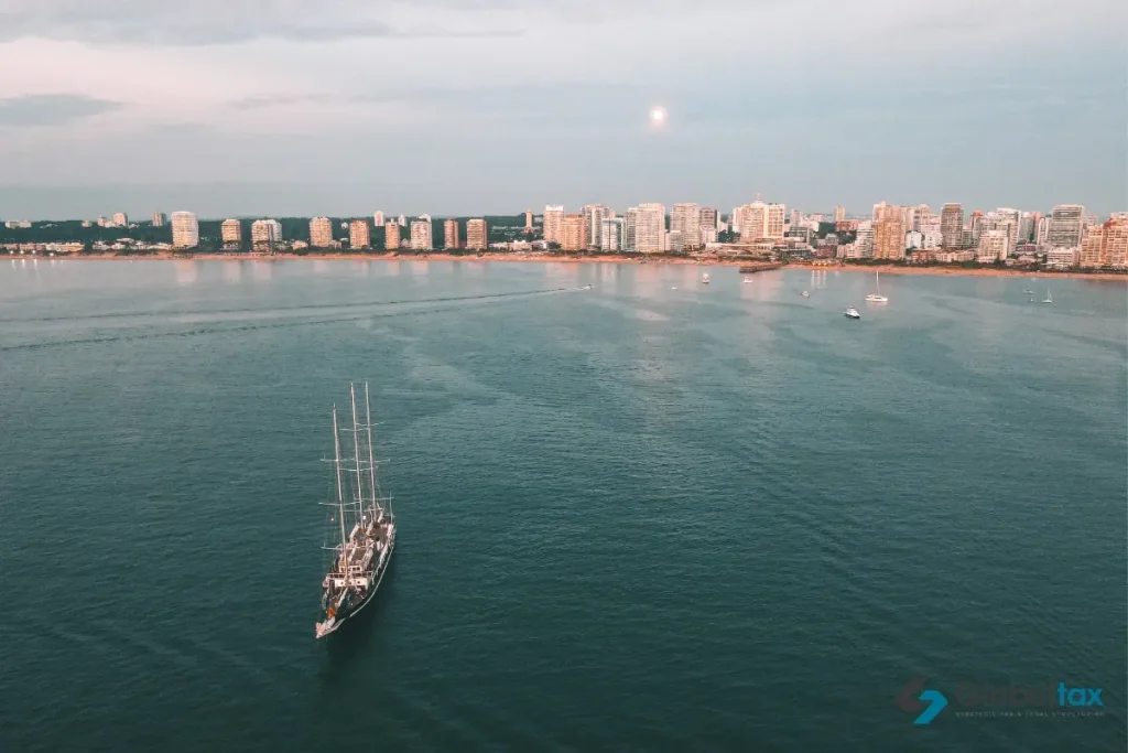 Sailboat off the Punta del Este waterfront skyline